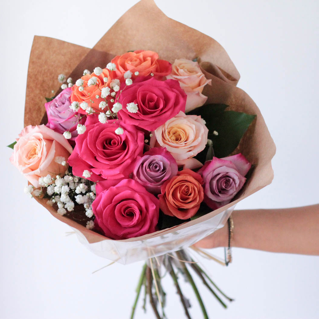 Wrapped Multicolored Dozen Roses with Babies' Breath and Greens